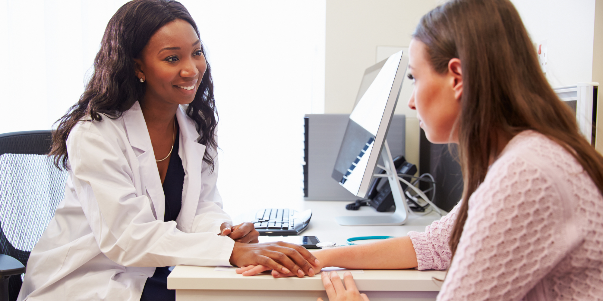 doctor and female patient talking about types of abortion